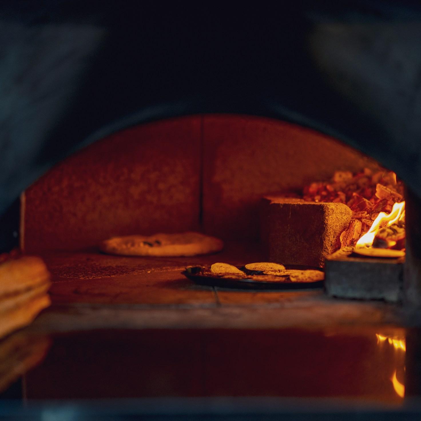 Community members collaborating in a modern kitchen space, sharing recipes and cooking techniques